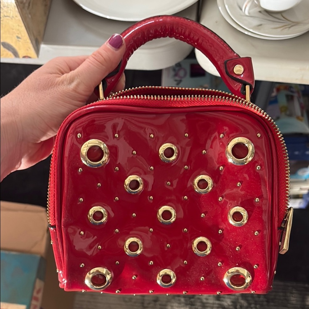 Red Patent Leather Handbag with Gold Accents